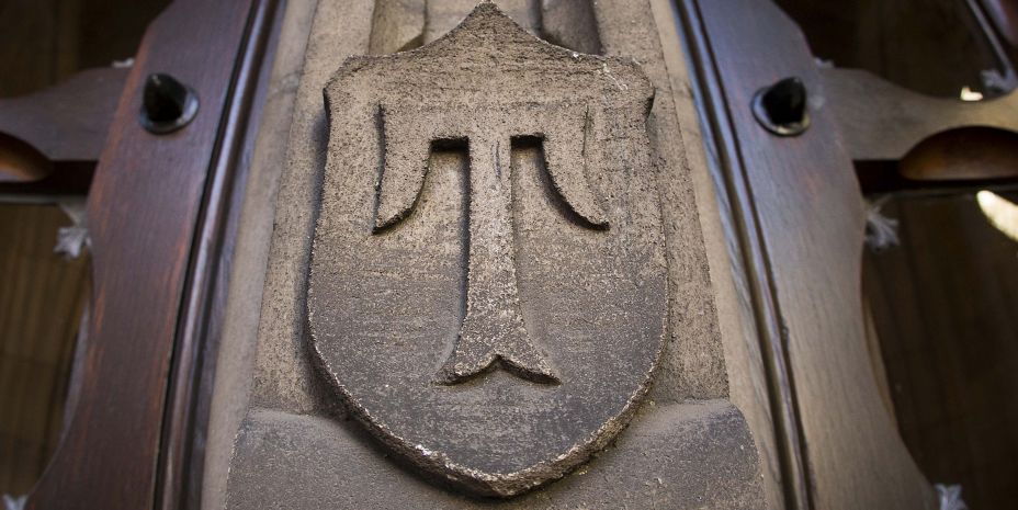 Picture of the Temple "T" embossed in stone.